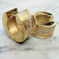 Solid 14k yellow gold hoop earrings with brushed and polished surfaces and a row of brilliant-cut diamonds